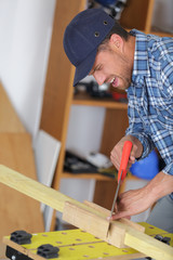 closeup of carpenter cutting his hand by accident