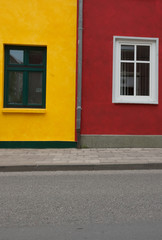 windows on yellow and red house