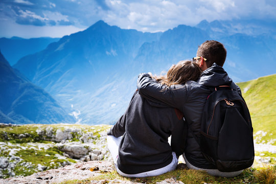 Couple Of Travelers On Top Of A Mountain. Mangart, Julian Alps, Slovenia.