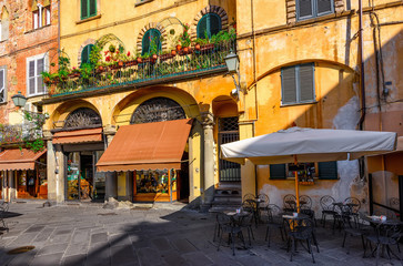 Old cozy street in Lucca, Italy - obrazy, fototapety, plakaty