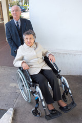 elderly couple in street