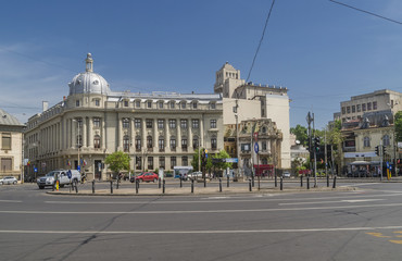 Fototapeta na wymiar Bucharest Academy of Economic Studies in Piata Romana square, Bucharest, Romania, on a sunny day