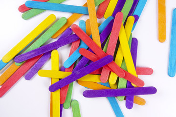 Fototapeta premium Colourful wooden sticks on white background