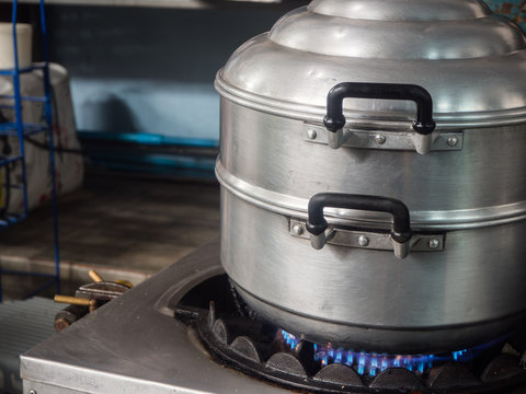 Stainless steel steamer on gas stove