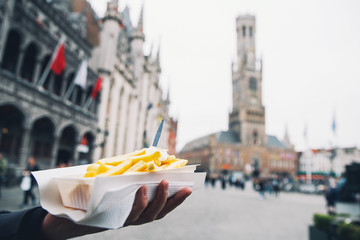 Naklejka premium Popular street junk food in Bruges, Belgium is French Fries with mayonnaise
