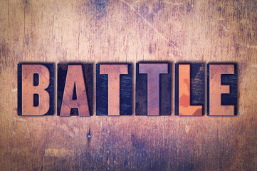 Battle Theme Letterpress Word on Wood Background