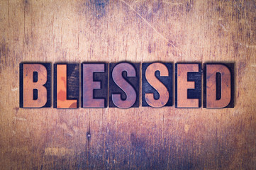 Blessed Theme Letterpress Word on Wood Background