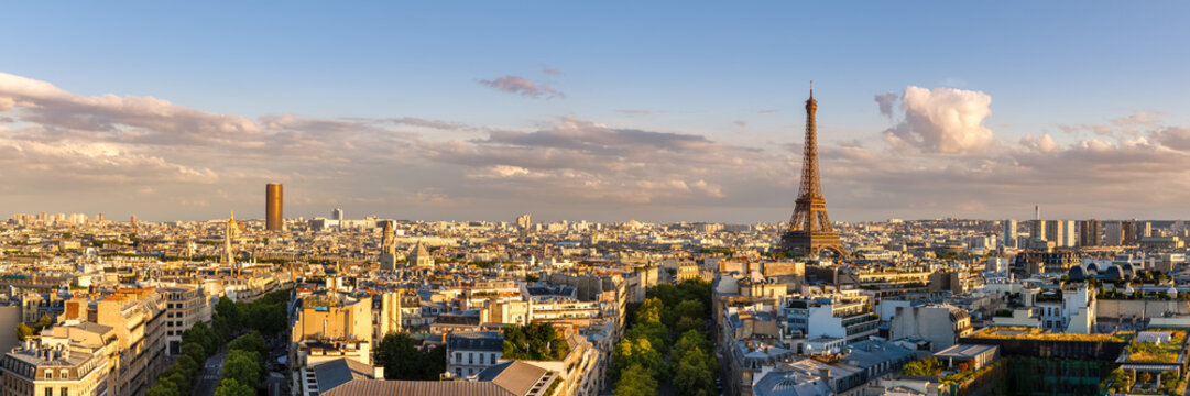 Panoramic summer view of Paris rooftops at sunset with the Eiffel Tower. 16th Arrondissement, Paris, France