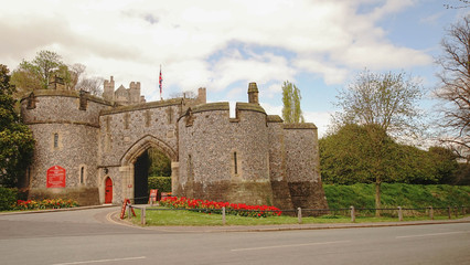 Arundel castle entrance big gate historical place in england flower garden view / Arundel castle