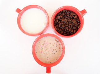 Three cups with coffee sugar and milk
