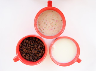 Three cups with coffee sugar and milk