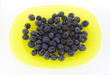 Blueberries on yellow plate