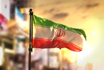 Iran Flag Against City Blurred Background At Sunrise Backlight - 154244772
