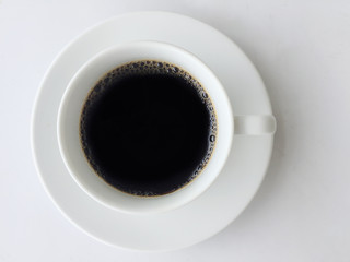 top view of black coffee in white cup with white background