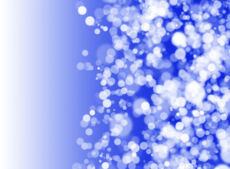 abstract blurred lights bokeh on blue background with copy space.