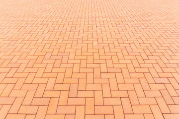 Paver brick floor also call brick paving, paving stone or block paving. Manufactured from concrete or stone for road, path, driveway and patio. Empty floor in perspective view for texture background.