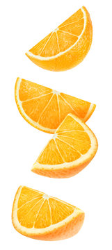Isolated floating orange wedges. Four falling pieces of orange fruit isolated on white background with clipping path