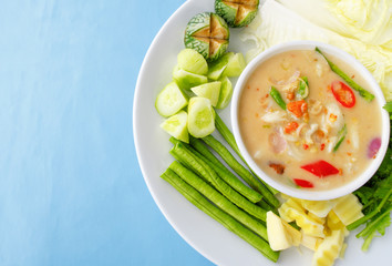 Salted crab stew with vegetables around a white plate concept for healthy; Thai; ASIAN foods