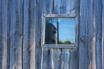photo of the old wooden façade with window and door