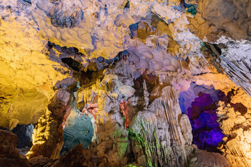 Colorful illumination in Dau Go cave in Halong Bay, Vietnam