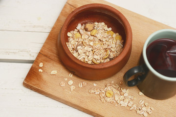 Rolled oats in a bowl and tea