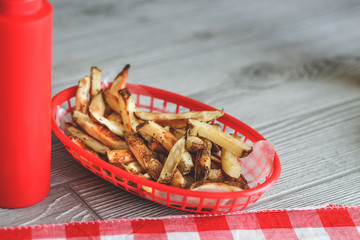 Summer cooking tabletop with homemade hamburgers and frenchfries