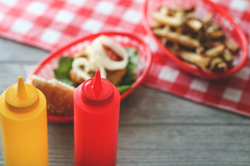 Summer cooking tabletop with homemade hamburgers and frenchfries