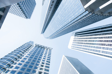 Obraz na płótnie Canvas View of modern blue colored contemporary office city buildings 