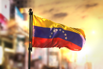 Venezuela Flag Against City Blurred Background At Sunrise Backlight - 154265755