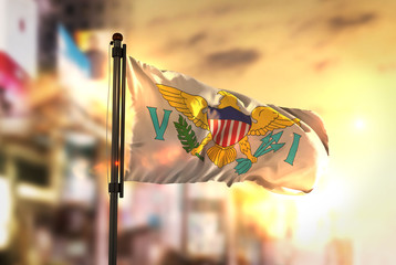 United States Virgin Islands Flag Against City Blurred Background At Sunrise Backlight © natanaelginting