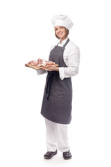 full length portrait of smiling woman professional chef, cook or butcher holding raw meat steak isolated on white background. restaurant, dieting, bbq and cooking food concept. grocery advertisement