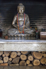 Buddha statue inside a fireplace