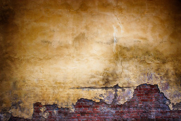 Obraz premium Old brick wall with peeling plaster, grunge background