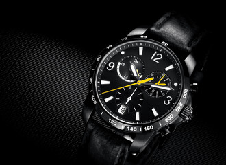 close up view of nice man's wrist watch on black background - Powered by Adobe