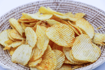 Potato fries or  French fries in a basket  isolated on white backgroundใ