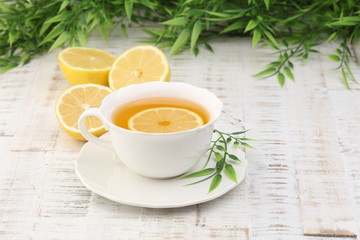 Tea. Herbal tea. Mint leaf. Tea in a glass cup, mint leaves, dried tea, sliced lime. herbs on a slate plate in a restaurant or teahouse