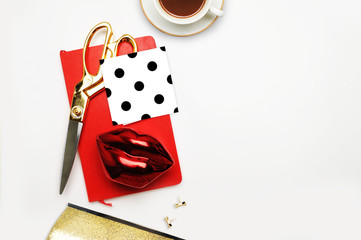 Fashionable background, Red lips with red notebook, flat lay and top view. Coffee and gold accessory. Polka dots pattern
