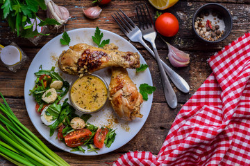 Chicken drumsticks with vegetable salad 