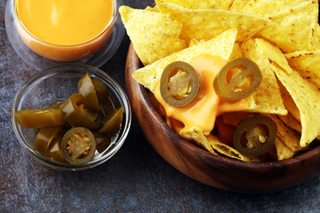 A plate of delicious tortilla nachos with melted cheese sauce