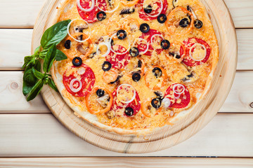 Assorted Pizza on the wooden background