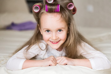 little girl face, curlers, close up