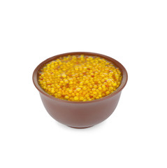 Bowl of delicious Dijon mustard sauce isolated on white