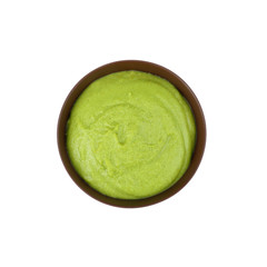 Bowl of delicious wasabi sauce isolated on white