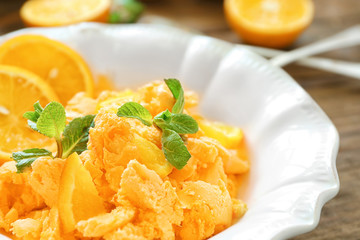 Plate with delicious citrus ice cream, closeup