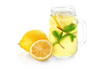 Delicious lemon juice in mason jar on white background