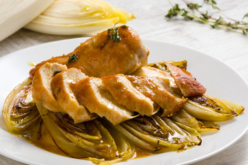 fried chicken and chicory in sauce