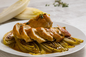 fried chicken and chicory in sauce