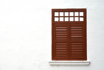 Brown wooden window on white wall with copy space