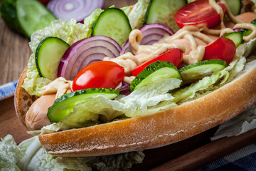 Homemade sandwich on a wooden table.