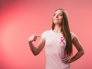 Woman wih pink cancer ribbon on chest